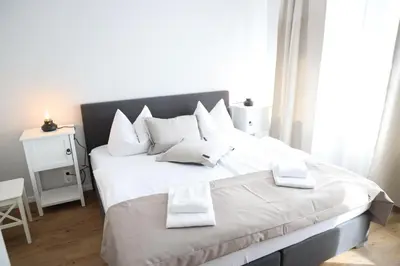 Ein Bett oder Betten in einem Zimmer der Unterkunft Apartments Meerzeit B
