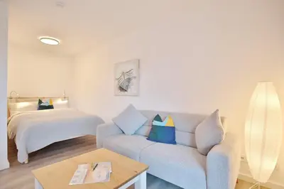 Ein Bett oder Betten in einem Zimmer der Unterkunft Ferienhaus Dornkampstraße 1 a Ferienhaus Dornkampstrasse 1a Appartement 2