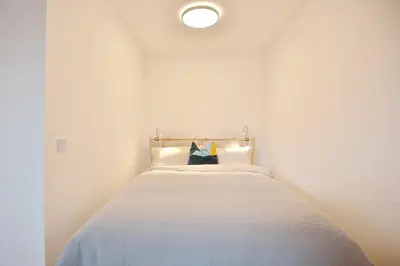 Ein Bett oder Betten in einem Zimmer der Unterkunft Ferienhaus Dornkampstraße 1 a Ferienhaus Dornkampstrasse 1a Appartement 2