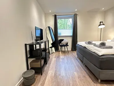 Ein Bett oder Betten in einem Zimmer der Unterkunft M&K Homes Eleganter Neubau zwischen Hamburg&Ostsee mit Parkplatz