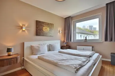 Ein Bett oder Betten in einem Zimmer der Unterkunft Die Insel Seaside Appartement 7