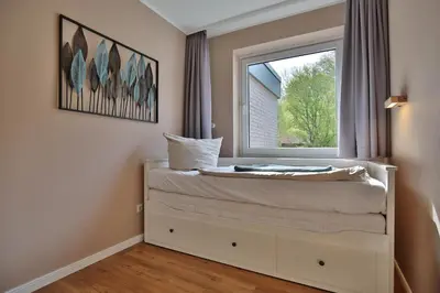 Ein Bett oder Betten in einem Zimmer der Unterkunft Die Insel Seaside Appartement 7