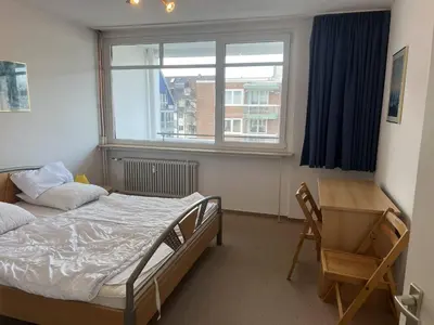 Ein Bett oder Betten in einem Zimmer der Unterkunft Direkt am Strand in Scharbeutz