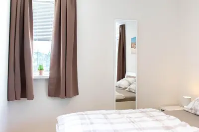 Ein Bett oder Betten in einem Zimmer der Unterkunft Ferienwohnung Seebrücke 18 - Scharbeutz
