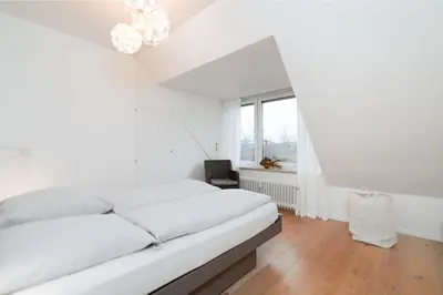 Ein Bett oder Betten in einem Zimmer der Unterkunft Dünenrausch