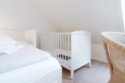 Ein Bett oder Betten in einem Zimmer der Unterkunft Dünenrausch