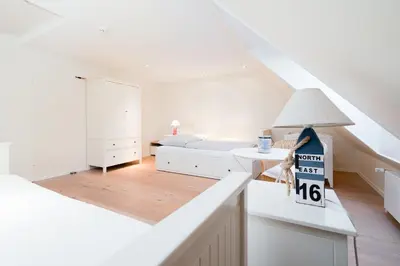Ein Bett oder Betten in einem Zimmer der Unterkunft Dünenrausch