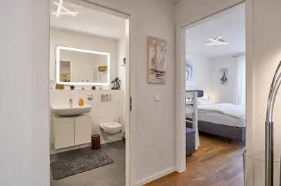 Ein Bett oder Betten in einem Zimmer der Unterkunft Moin am Meer! Hansastr 5 a