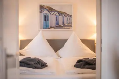 Ein Bett oder Betten in einem Zimmer der Unterkunft Meerhafen