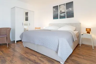 Ein Bett oder Betten in einem Zimmer der Unterkunft An der Waldkapelle 26 OstseePanorama 19