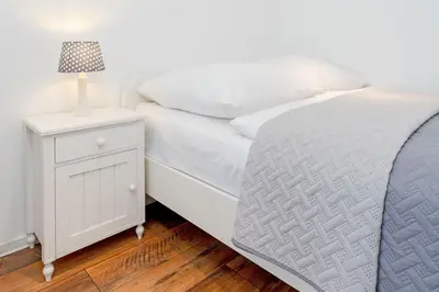 Ein Bett oder Betten in einem Zimmer der Unterkunft An der Waldkapelle 26 OstseePanorama 19