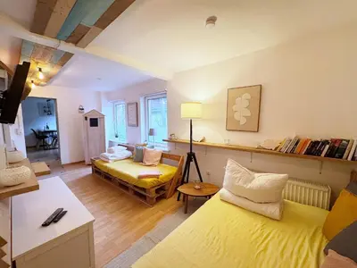 Ein Bett oder Betten in einem Zimmer der Unterkunft Geibel-Haus Fewo Wellenbrecher bis 4 Personen
