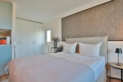 Ein Bett oder Betten in einem Zimmer der Unterkunft Seetempel Appartement 26 