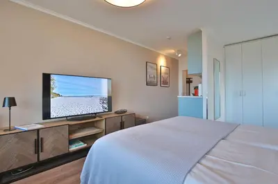 Ein Bett oder Betten in einem Zimmer der Unterkunft Seetempel Appartement 26 