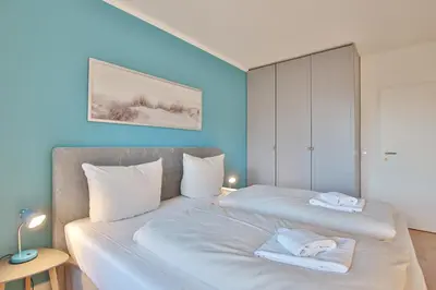 Ein Bett oder Betten in einem Zimmer der Unterkunft Haus Meeresstrand Appartement 116