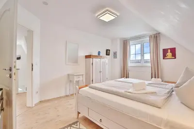 Ein Bett oder Betten in einem Zimmer der Unterkunft Das Friesenhaus