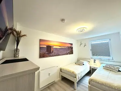 Ein Bett oder Betten in einem Zimmer der Unterkunft Ferienwohnung Strandblick