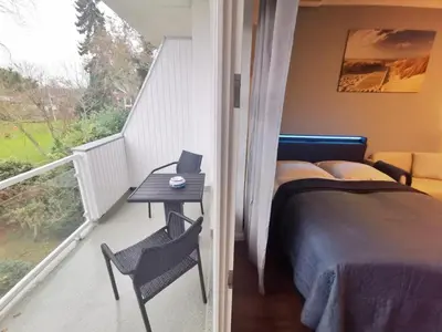 Ein Bett oder Betten in einem Zimmer der Unterkunft Obj 25 Top FeWo Mönkemeier für 2 Personen + 1 Kleinkind bis 3 Jahre Hund