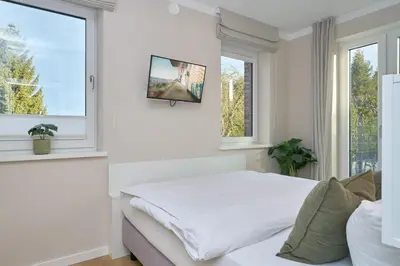 Ein Bett oder Betten in einem Zimmer der Unterkunft Saltwater House Scharbeutz Sea Eagle Scharbeutz
