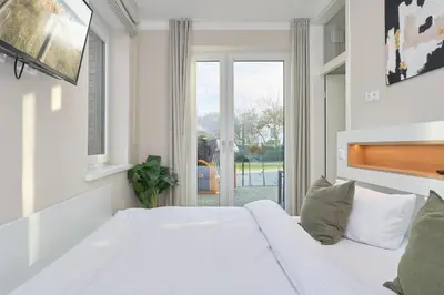 Ein Bett oder Betten in einem Zimmer der Unterkunft Saltwater House Scharbeutz Sea Eagle Scharbeutz