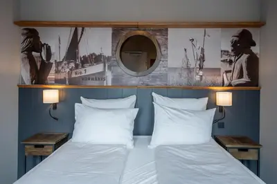 Ein Bett oder Betten in einem Zimmer der Unterkunft 4Hafenzeiten - NIE7 Vorwärts