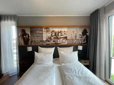 Ein Bett oder Betten in einem Zimmer der Unterkunft 4Hafenzeiten - NIE8 Albatros