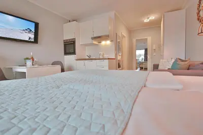Ein Bett oder Betten in einem Zimmer der Unterkunft Haus Adria Appartement 28 Küstenliebe