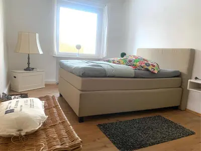 Ein Bett oder Betten in einem Zimmer der Unterkunft Großartige Wohnung mit großem Garten in Bad Schwartau!