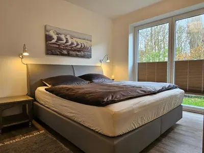 Ein Bett oder Betten in einem Zimmer der Unterkunft Ferienwohnung 