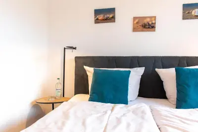 Ein Bett oder Betten in einem Zimmer der Unterkunft Ferienwohnung Ostseeferienparadies Timmendorfer Strand