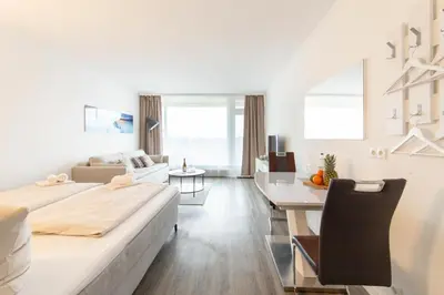 Ein Bett oder Betten in einem Zimmer der Unterkunft Ferienwohnung Residenz App. 101 Timmendorfer Strand