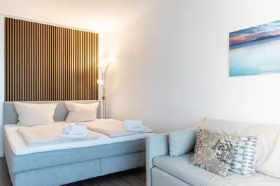Ein Bett oder Betten in einem Zimmer der Unterkunft Ferienwohnung Residenz App. 101 Timmendorfer Strand