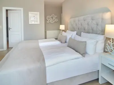 Ein Bett oder Betten in einem Zimmer der Unterkunft Techts Strandhaus