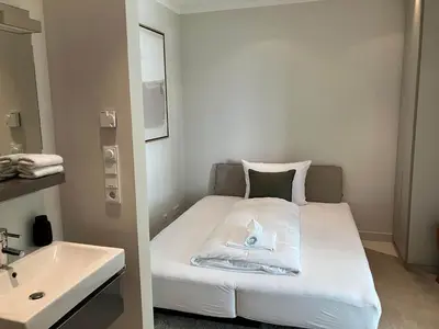 Ein Bett oder Betten in einem Zimmer der Unterkunft Modernes Ostsee Luxus-Penthouse Meerblick