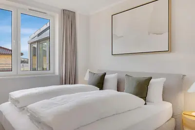 Ein Bett oder Betten in einem Zimmer der Unterkunft Modernes Ostsee Luxus-Penthouse Meerblick