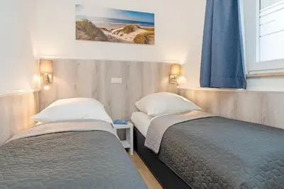 Ein Bett oder Betten in einem Zimmer der Unterkunft Wohnung 113