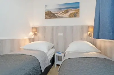 Ein Bett oder Betten in einem Zimmer der Unterkunft Wohnung 113