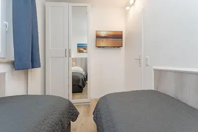 Ein Bett oder Betten in einem Zimmer der Unterkunft Wohnung 113