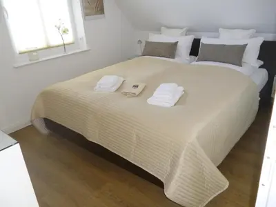 Ein Bett oder Betten in einem Zimmer der Unterkunft 2 Ostsee-Wellnesslandhäuser Sauna, Dampfbad, Jacuzzi