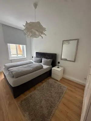 Ein Bett oder Betten in einem Zimmer der Unterkunft Altstadtinsel am Johanneum