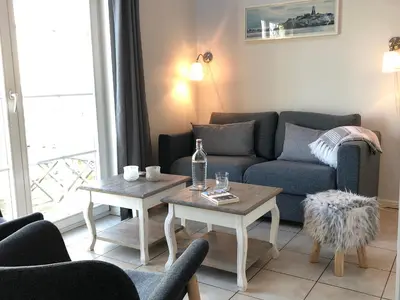Ein Sitzbereich in der Unterkunft Traumhaus meerZeit in Sierksdorf, super Meerblick, Sauna, Kaminofen, Whirlwanne