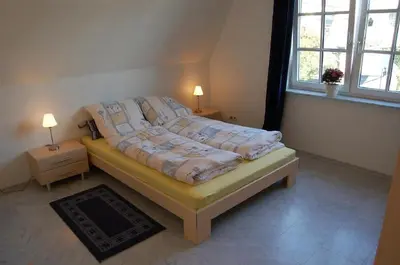 Ein Bett oder Betten in einem Zimmer der Unterkunft Gemütliche Ferienwohnung für 4 Personen