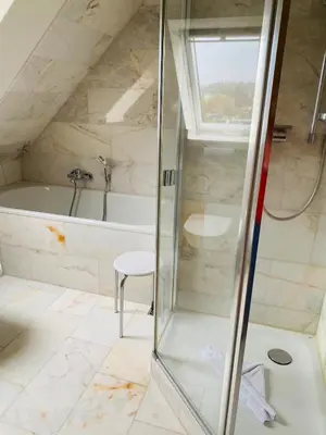 Ein Badezimmer in der Unterkunft Strandvilla Haffkrug Apartment Albatros