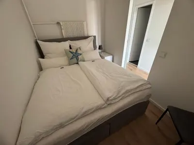 Ein Bett oder Betten in einem Zimmer der Unterkunft Ostsee Apartment mit Meerblick