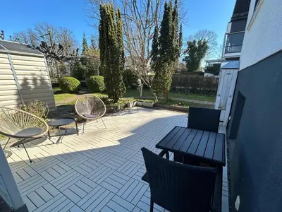 Ein Garten an der Unterkunft Entspannungssuite Küstenkind direkt am Strand Souterrain Wohnung