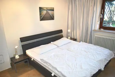 Ein Bett oder Betten in einem Zimmer der Unterkunft Haus OstseeBrise