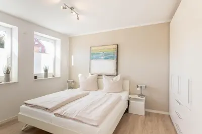 Ein Bett oder Betten in einem Zimmer der Unterkunft Ferienwohnung Passat