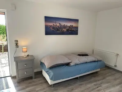 Ein Bett oder Betten in einem Zimmer der Unterkunft Landhof Schadehorn 