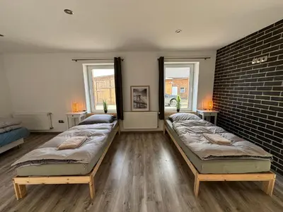 Ein Bett oder Betten in einem Zimmer der Unterkunft Landhof Schadehorn 