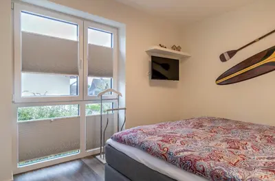 Ein Bett oder Betten in einem Zimmer der Unterkunft Neue Liebe Haffkrug 4